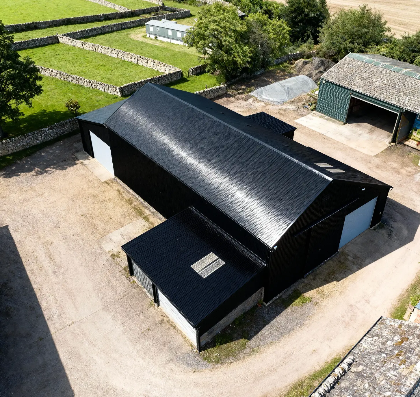Finished black agricultural shed viewed from above